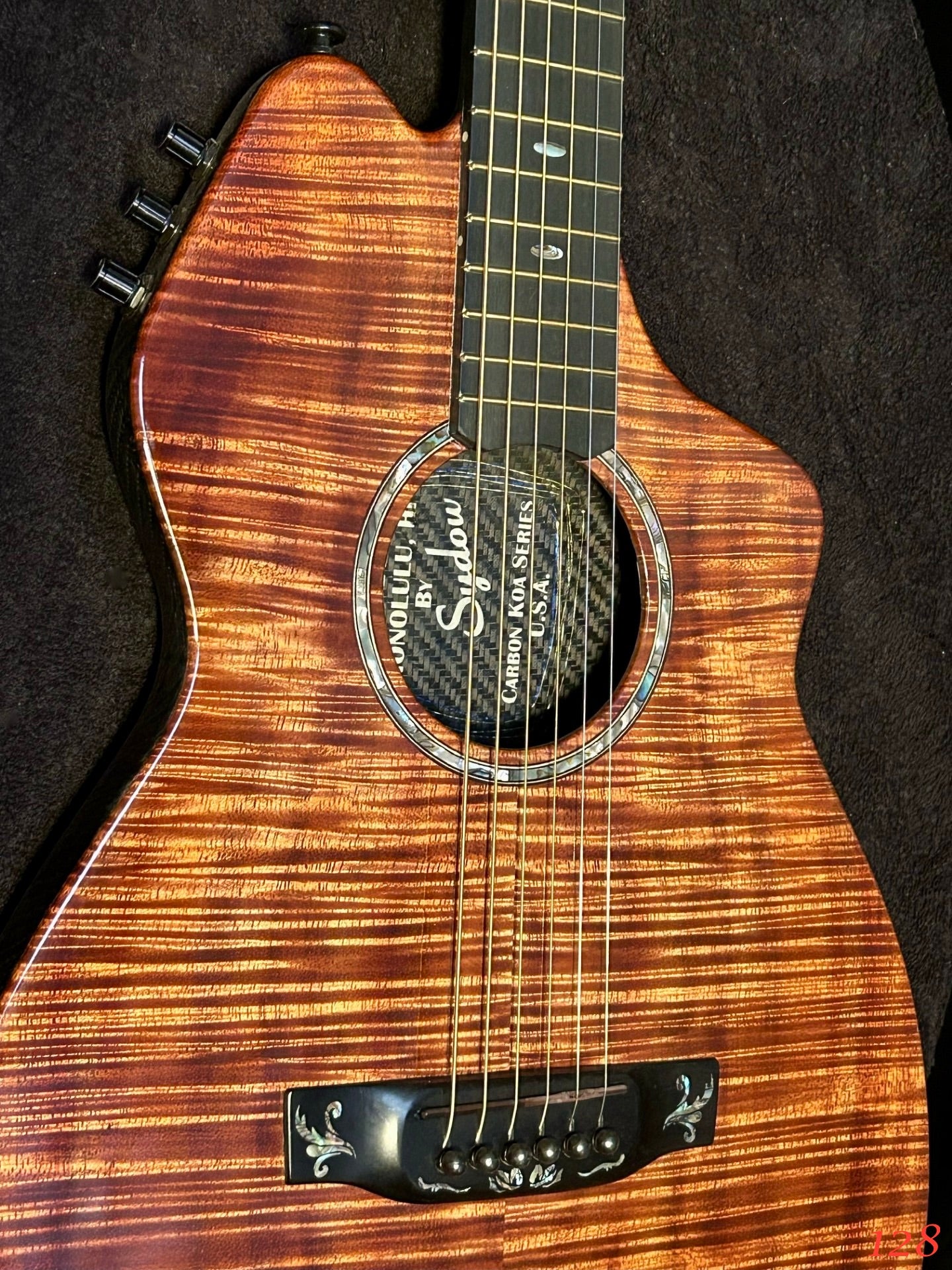 Carbon Fiber body with Koa top Guitar.